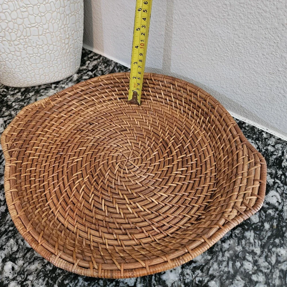 hand-woven rattan tray with a distinct spiral patterns serving plate